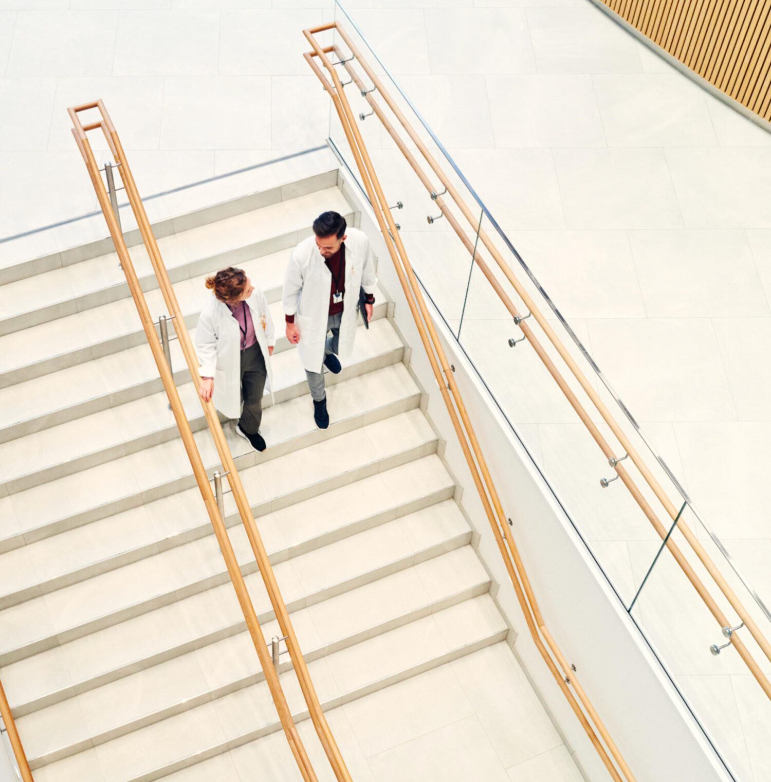 Staff walking through a modern public facility